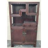 Antique Chinese wood unit with asymmetric shelves bordered with foliage molding.