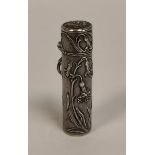 Art Nouveau silver cylindrical scent bottle, embossed with irises, 15mm x 57mm.