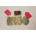 Three Chinese archaic and archaised jade carvings comprising; a green jade stone with a dragon