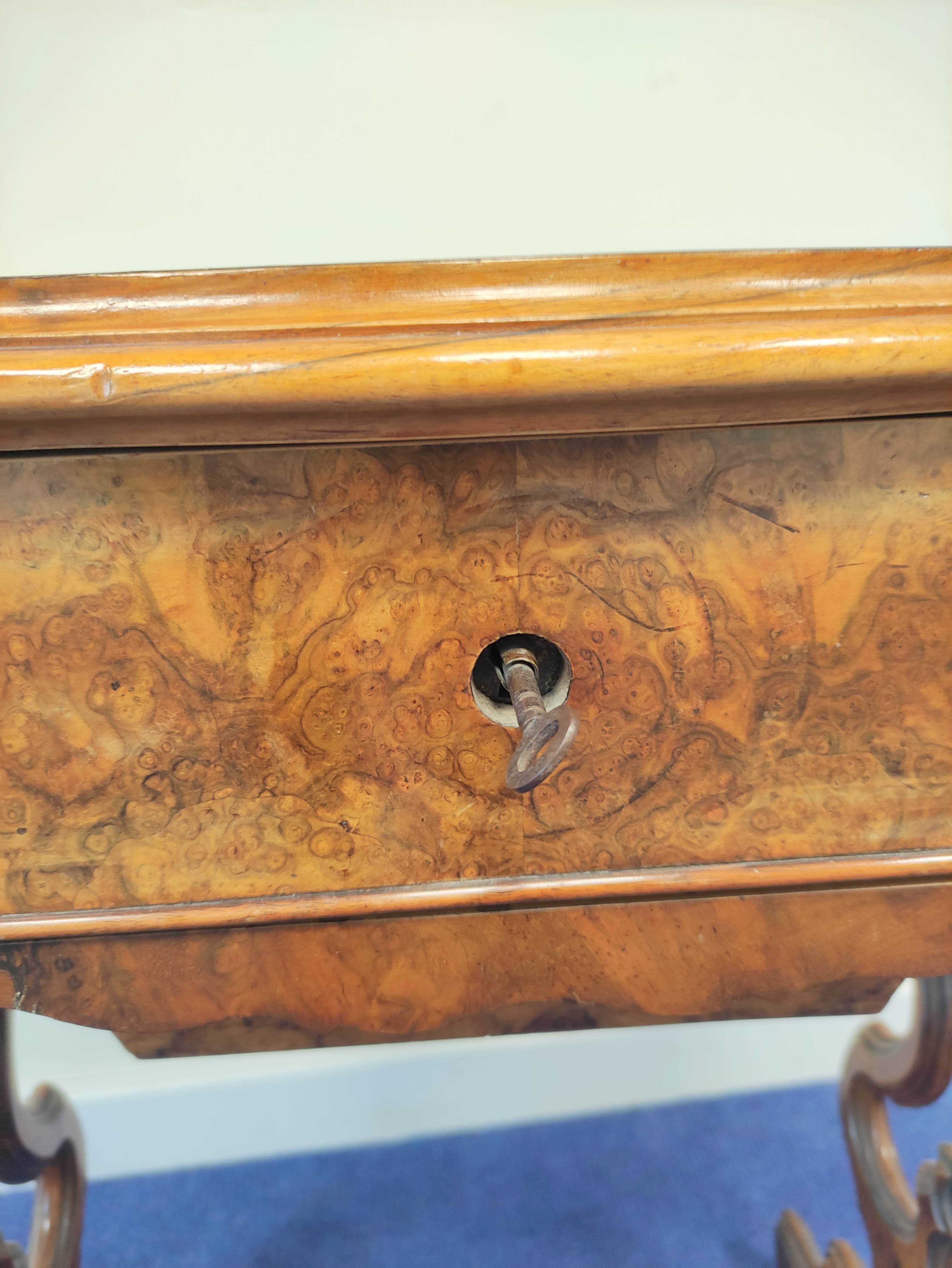 19th century burr walnut sewing table with hinged serpentine top enclosing a maple interior with a - Image 9 of 9