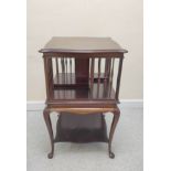 Edwardian mahogany revolving bookcase with serpentine revolving open top above a table base raised