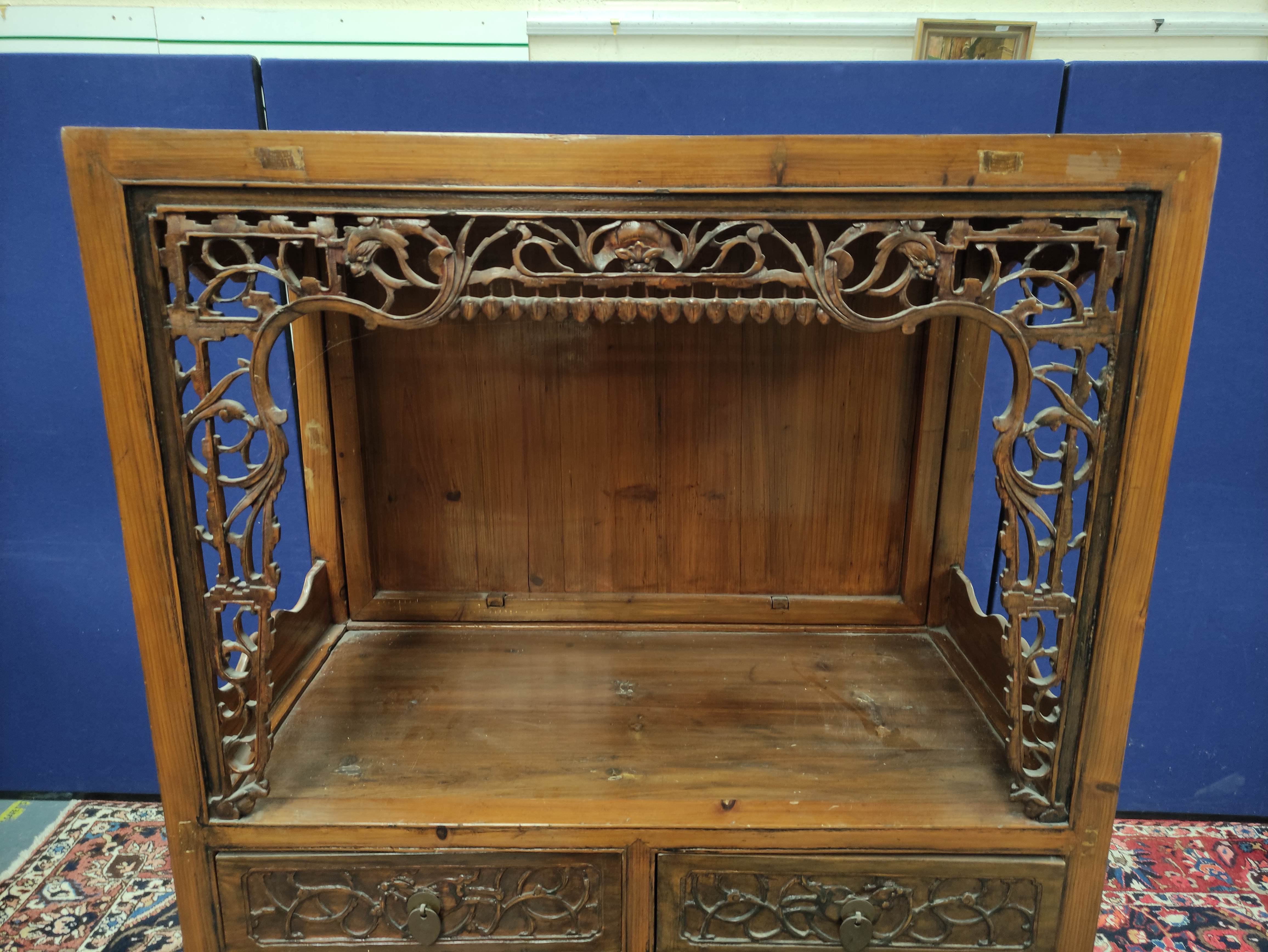 Chinese pine cupboard, with an open section to the top, decorated with Chinese fretwork, above two - Image 4 of 8