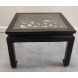 Chinese ebonised longevity coffee table, with a pierced top on shaped supports. 46cm high, 62.5cm