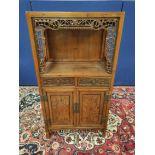 Chinese pine cupboard, with an open section to the top, decorated with Chinese fretwork, above two