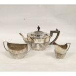 Silver three piece tea set, part fluted oval shape, inscribed by Huttons 1895, 871g/28oz.
