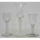 Antique drinking glass, the bell shaped bowl on knopped air twist straight stem and domed circular
