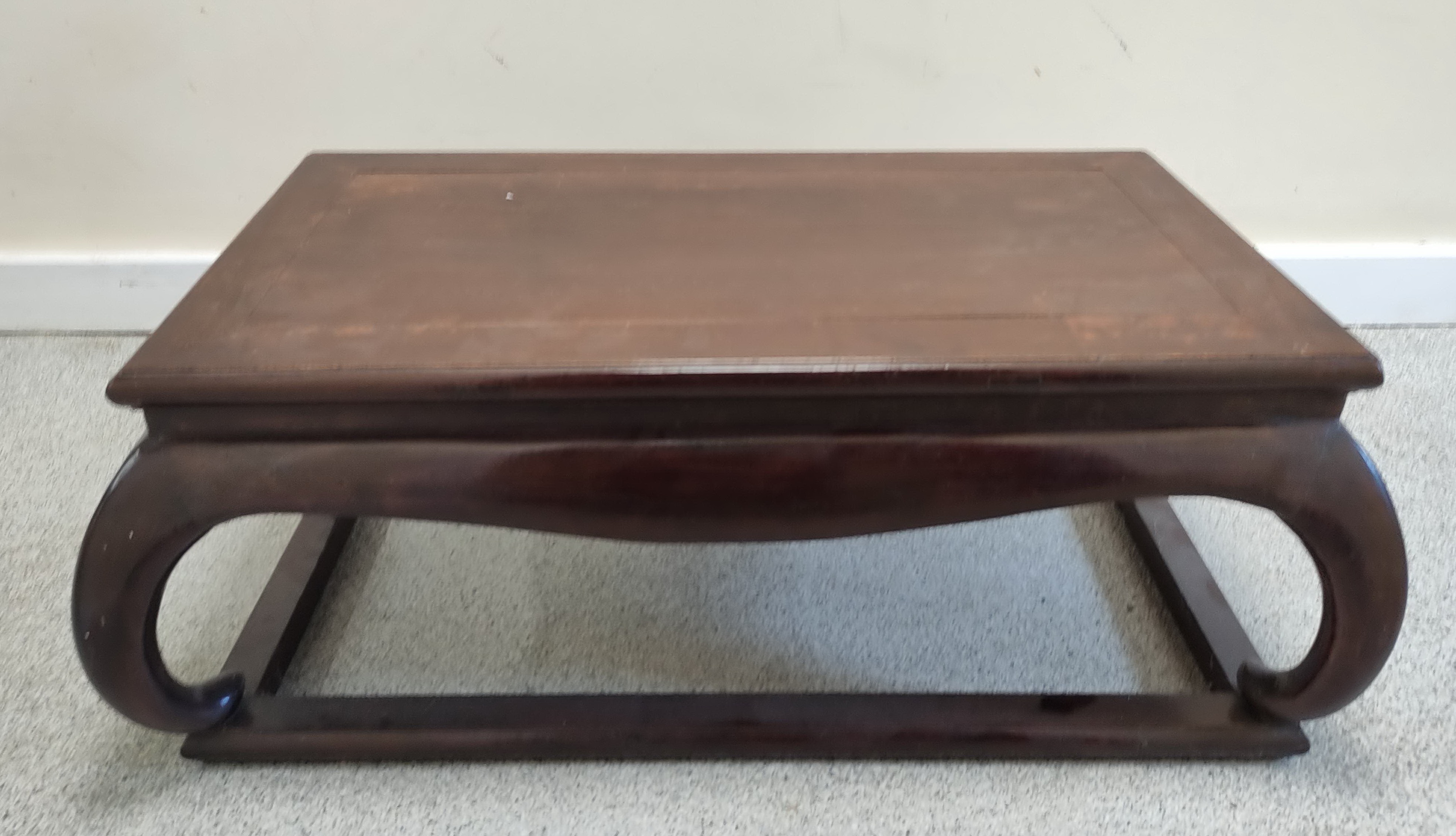 Antique chinese laquer opium table, with rectangular top on shaped supports and fixed plinth base.