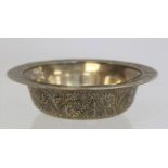 Oriental silvered circular brass bowl with engraved floral and foliate decoration, 16cm diam.