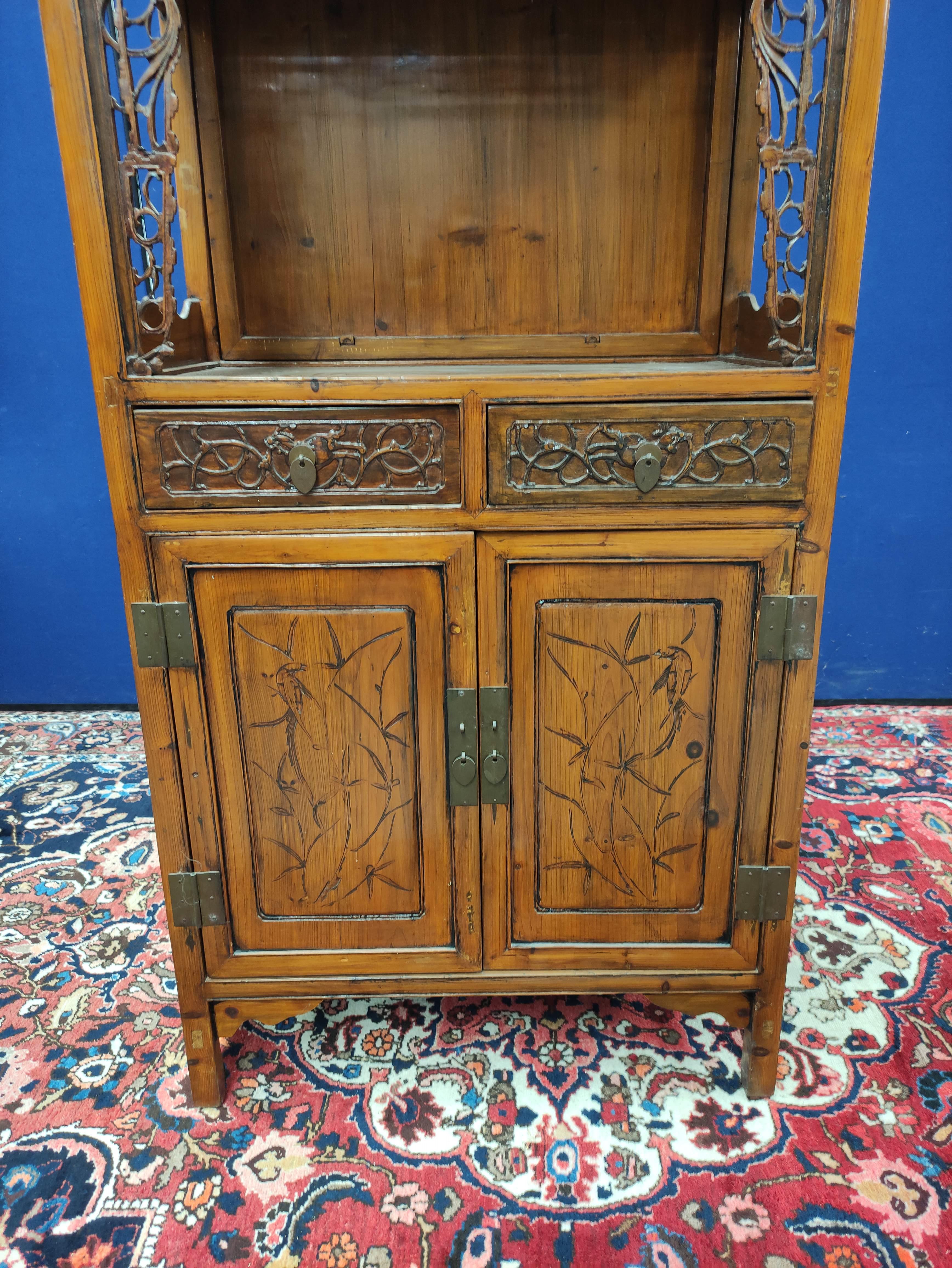 Chinese pine cupboard, with an open section to the top, decorated with Chinese fretwork, above two - Image 3 of 8