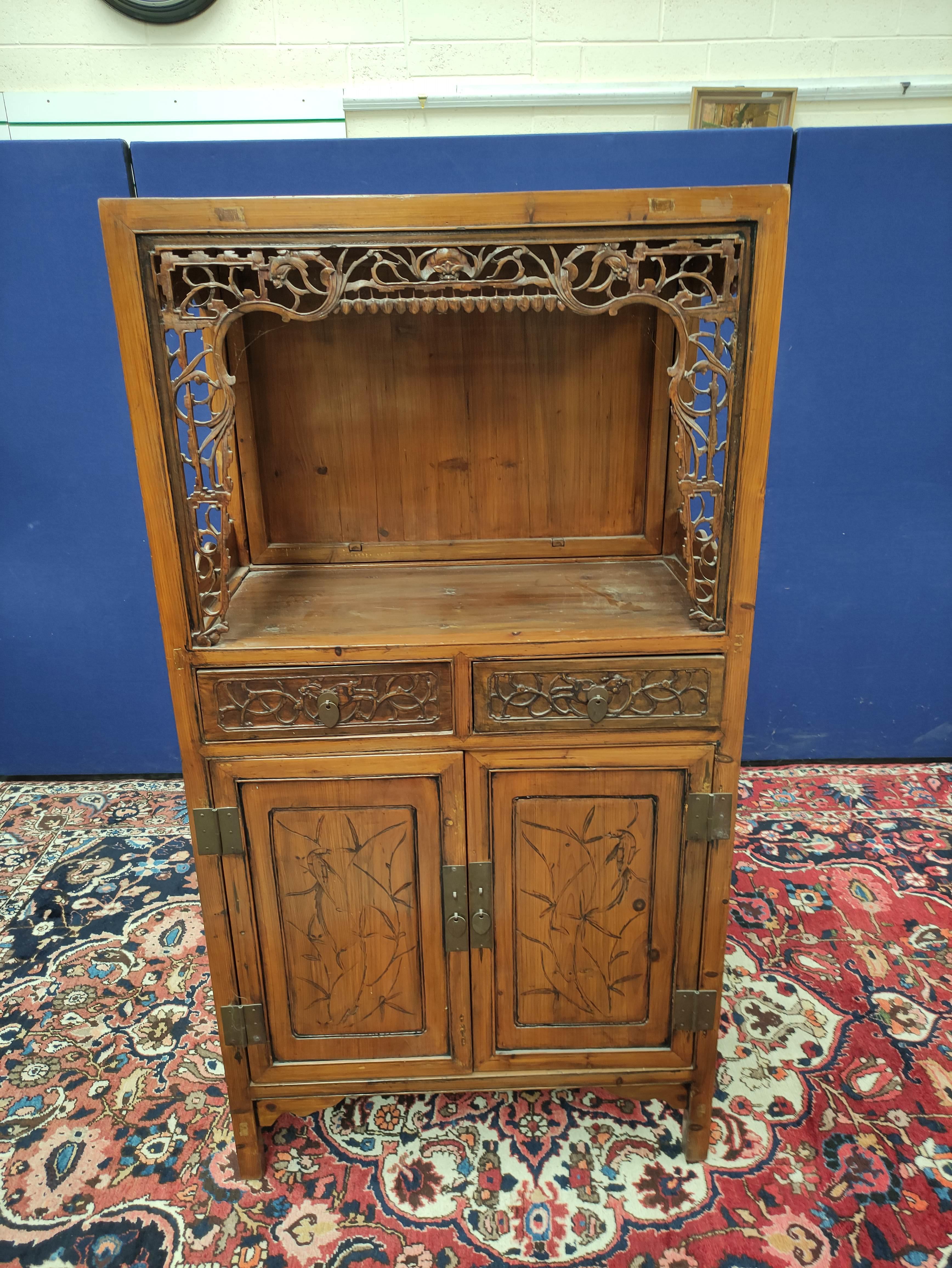 Chinese pine cupboard, with an open section to the top, decorated with Chinese fretwork, above two - Image 2 of 8