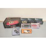 Eight boxed model Jaguars comprising of a Bburago 1:18 scale Jaguar E Coupe 1961 Cod 3018, three