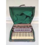 Vintage Scandalli Vibrante III accordion with faux ivory keys in fitted hard case.