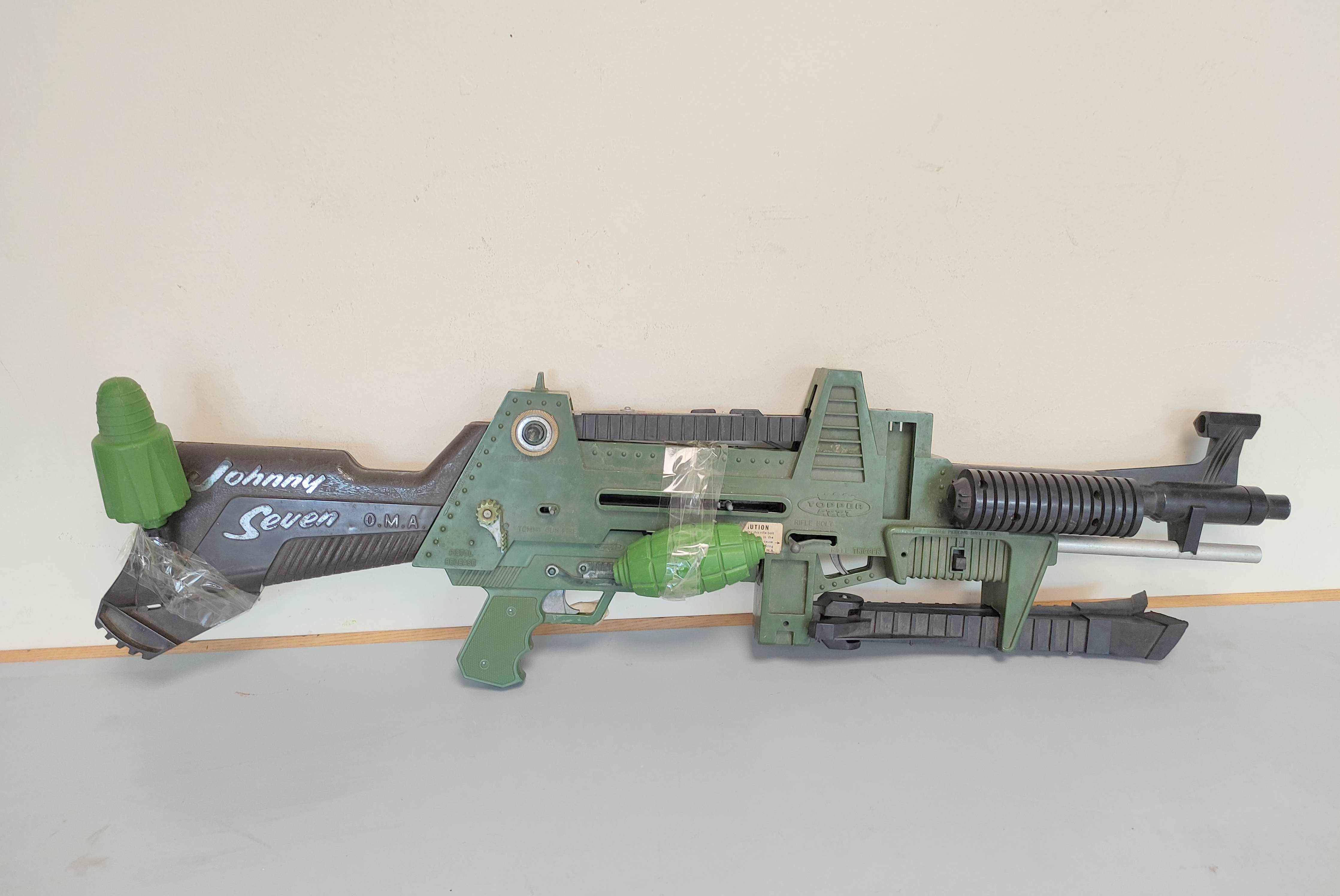 Topper Toys- Johnny Seven O.M.A One Man Army combat rifle of green plastic construction with bi-