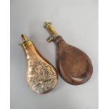 Two Victorian powder flasks one of brass and leather construction, the other of copper and brass