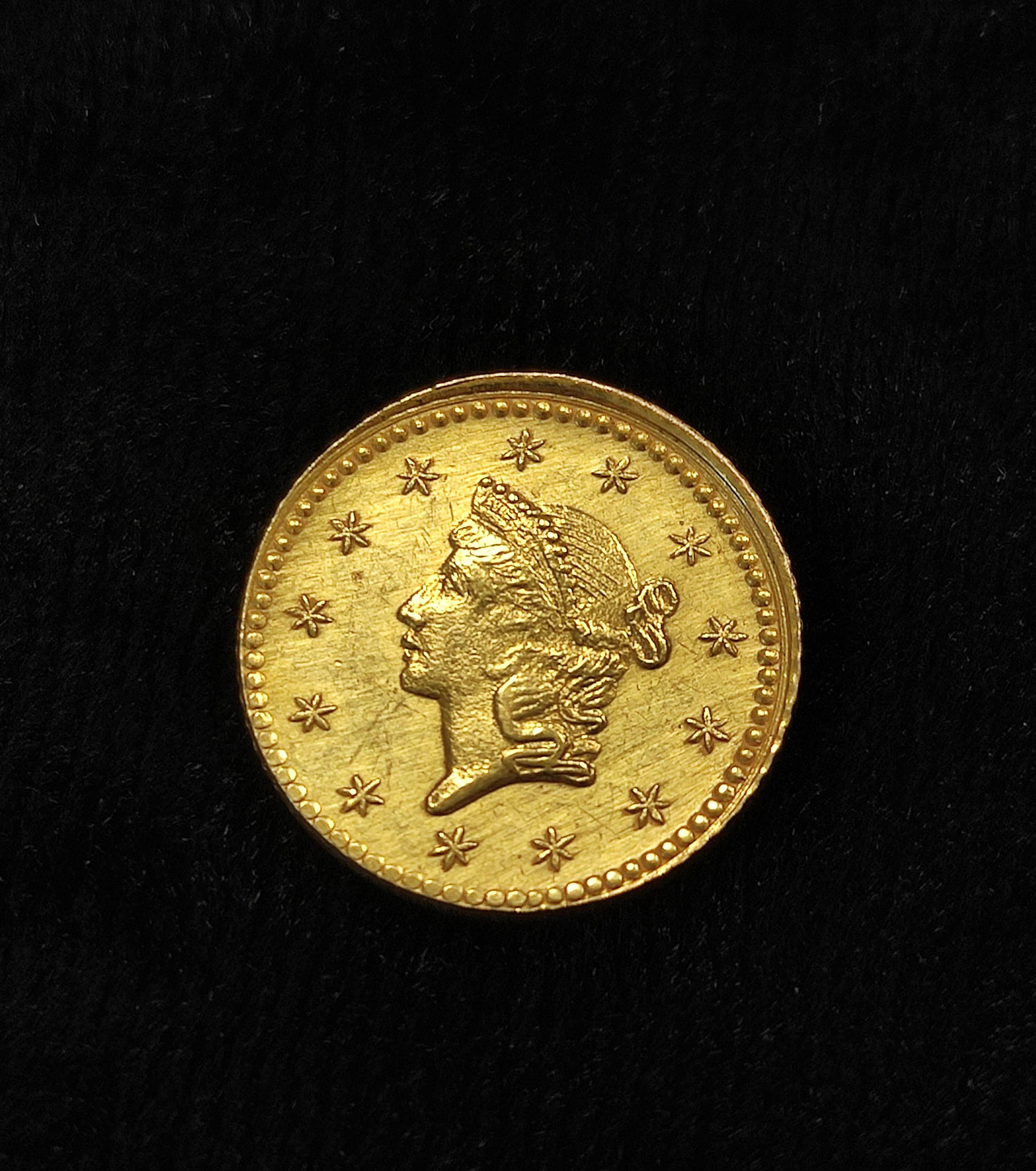 USA. 1853 $1 .900 grade gold coin believed to be a jeweller's copy.