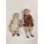 Two 19th century Victorian porcelain child's dolls with applied painted features. (2)