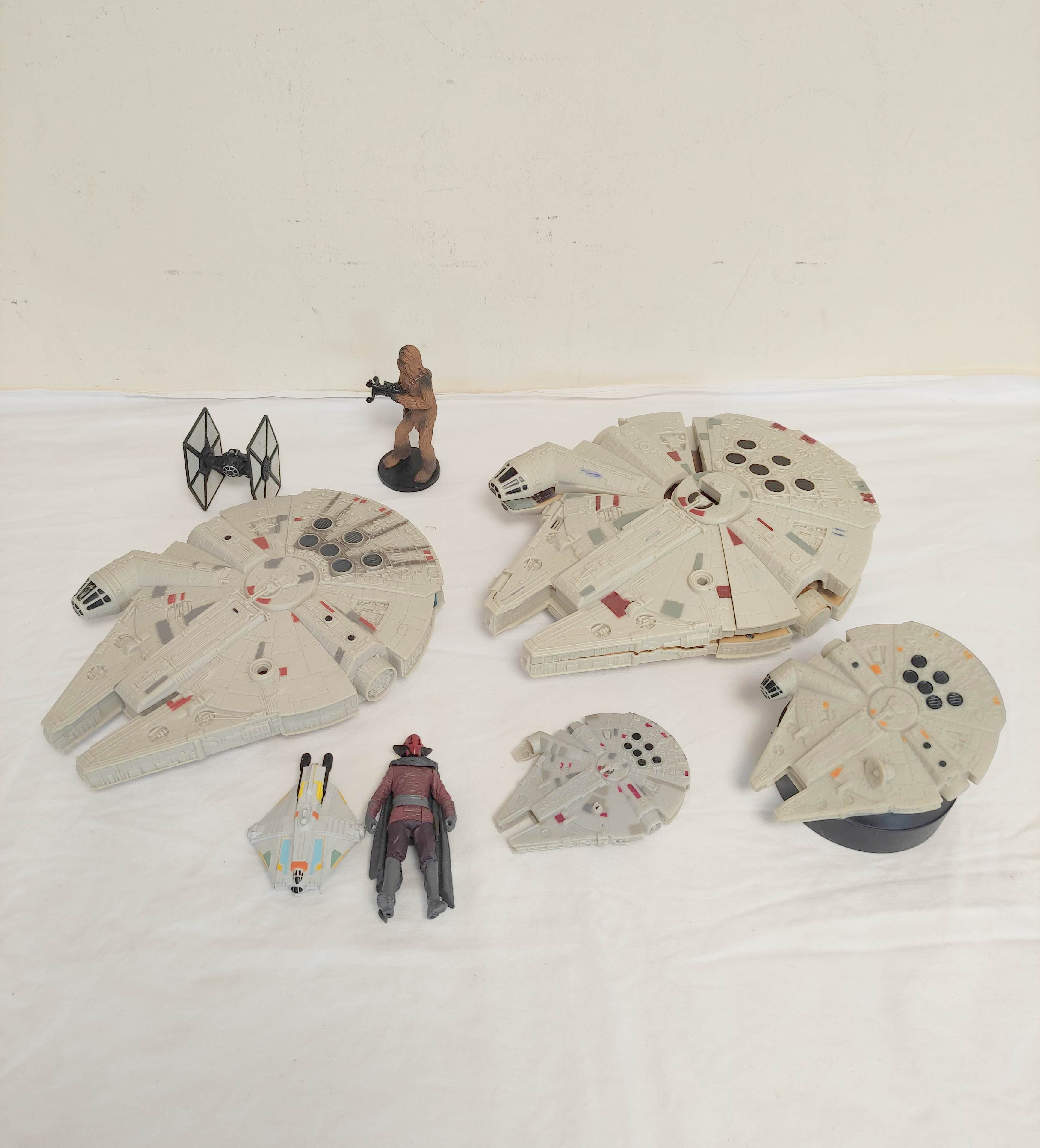 Star Wars. The Force Awakens action figures to include four Millenium Falcon spacecrafts one by