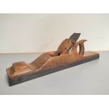 Antique Victorian jointer plane of hardwood (likely maple) construction with blade by Mathieson &