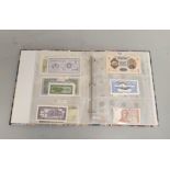 Banknotes. Folder containing a quantity of pristine world banknotes and coins to include a 1955