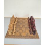 Contemporary composite chess set modeled after medieval figures.