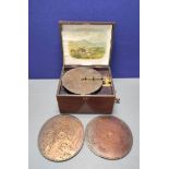 Monopol disc musical box in wooden case and trade label stating size No. 42 to underside. Also