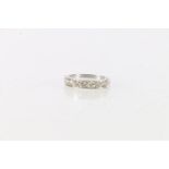 Platinum and diamond eight stone half eternity rings, 'Jack to Maimie 13/2/64, size R, 4.1g.