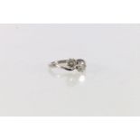 18ct gold and platinum diamond two stone cross-over ring, each diamond approx. 0.75ct in claw