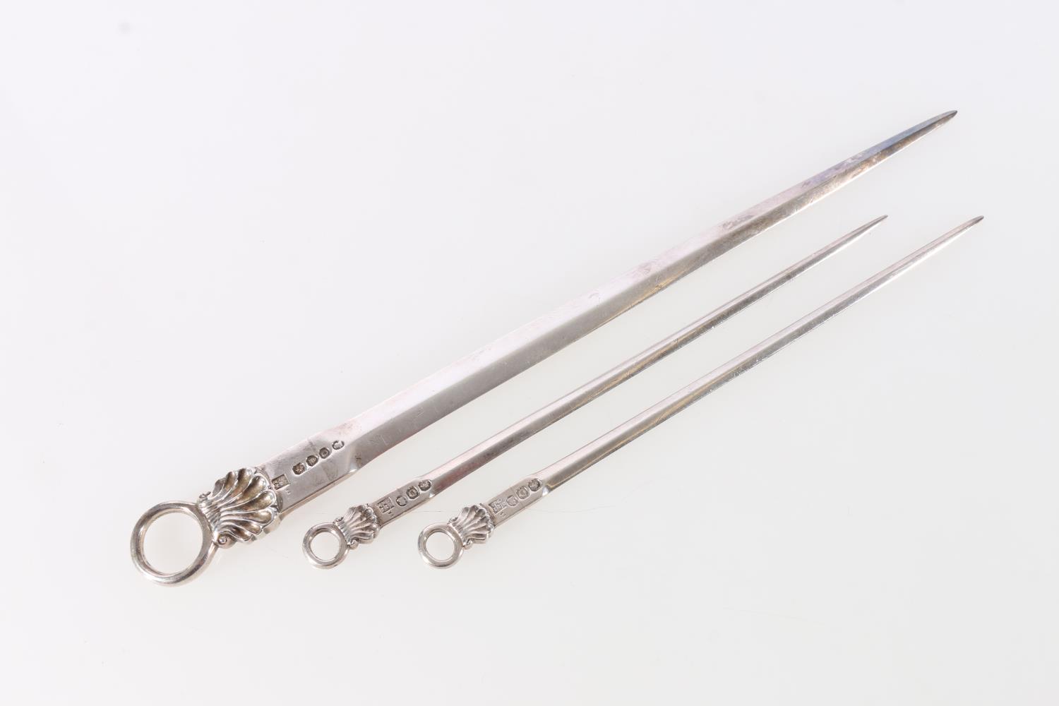 Pair of George III sterling silver meat skewers, with shell decorated ring handles, William Eley,