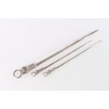 Pair of George III sterling silver meat skewers, with shell decorated ring handles, William Eley,