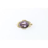 Unhallmarked faceted amethyst set gold brooch, 4.5g.