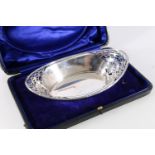 Cased sterling silver pierced basket of boat shape, James Dixon & Son, Birmingham, 1906, 143g.