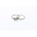 Platinum and diamond solitaire ring, size J, 3.4g, and a matching platinum engraved wedding band,