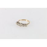 18ct gold diamond fire stone ring, the diamonds with claw setting, size P1/2, stamped SS, 3.2g.