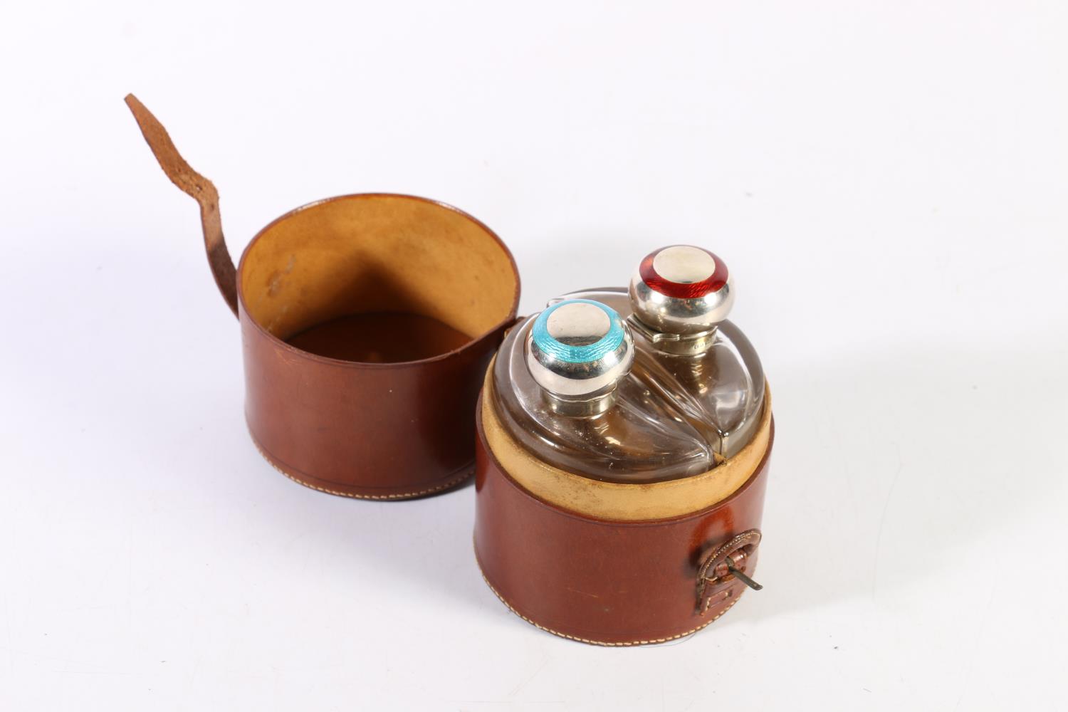 Victorian leather cased cylindrical twin bottle travelling set, with sterling silver and enamel tops