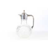 Sterling silver mounted cut-glass claret jug of bulbous form, with star cut base, W H Lyde,