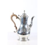 Early George III sterling silver coffee pot of pear shape, with finial topped hinged cover and