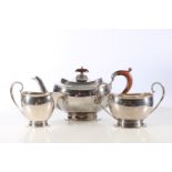 George V sterling silver three piece tea service of plain form, Adie Brothers, Birmingham, 1096g.