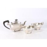 George V Art Deco three piece sterling silver tea service comprising a teapot, a sugar bowl and a