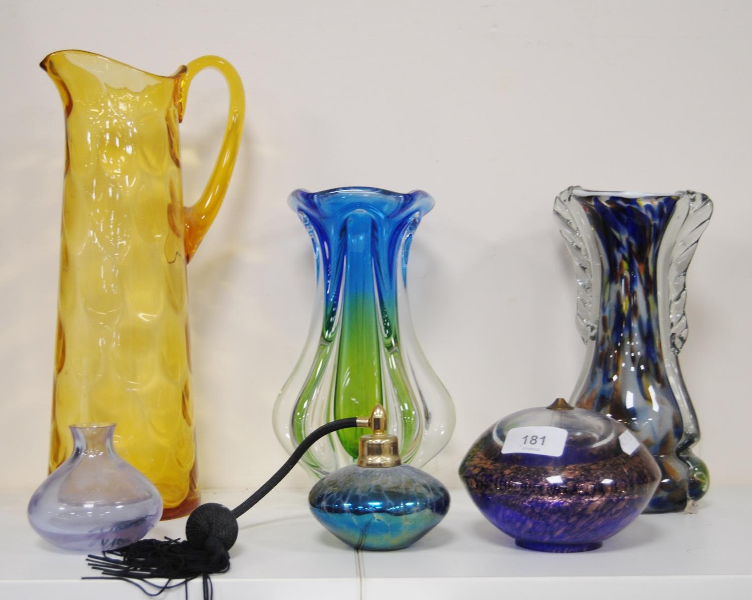 Coloured and art glass to include a mottled glass vase, amber-coloured glass jug, two-tone