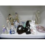Pair of German pottery figures, Royal Doulton figure group and other figures (one shelf).