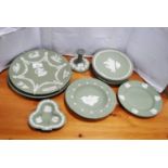 Group of Wedgwood green Jasper ware wall plates, candlestick (a/f), clover-shaped dish etc.  (10)