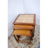 Retro G Plan teak nest of three tables with tiled top.