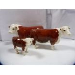 Beswick 'Champion of Champions' Hereford bull, cow and a calf.  (3)