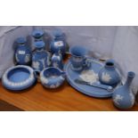 Group of Wedgwood blue Jasper ware items to include spill vases, bell, shallow bowl, tray,