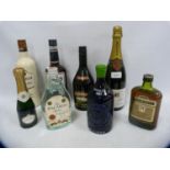 Bottle of Reims champagne, 75cl, half bottle of Martell Cognac, half bottle of Bacardi, half