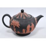 Wedgwood Black Basalt limited edition teapot decorated with coral-coloured classical figures and