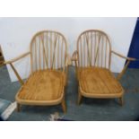 Pair of blonde Ercol armchairs.  (2)