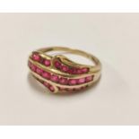 9ct gold ring set with small ruby-style stones, 2.9g gross.