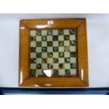 Antique pietra dura-style chess board in maple frame.
