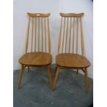 Pair of blonde Ercol Windsor-style stick-back dining chairs.  (2)